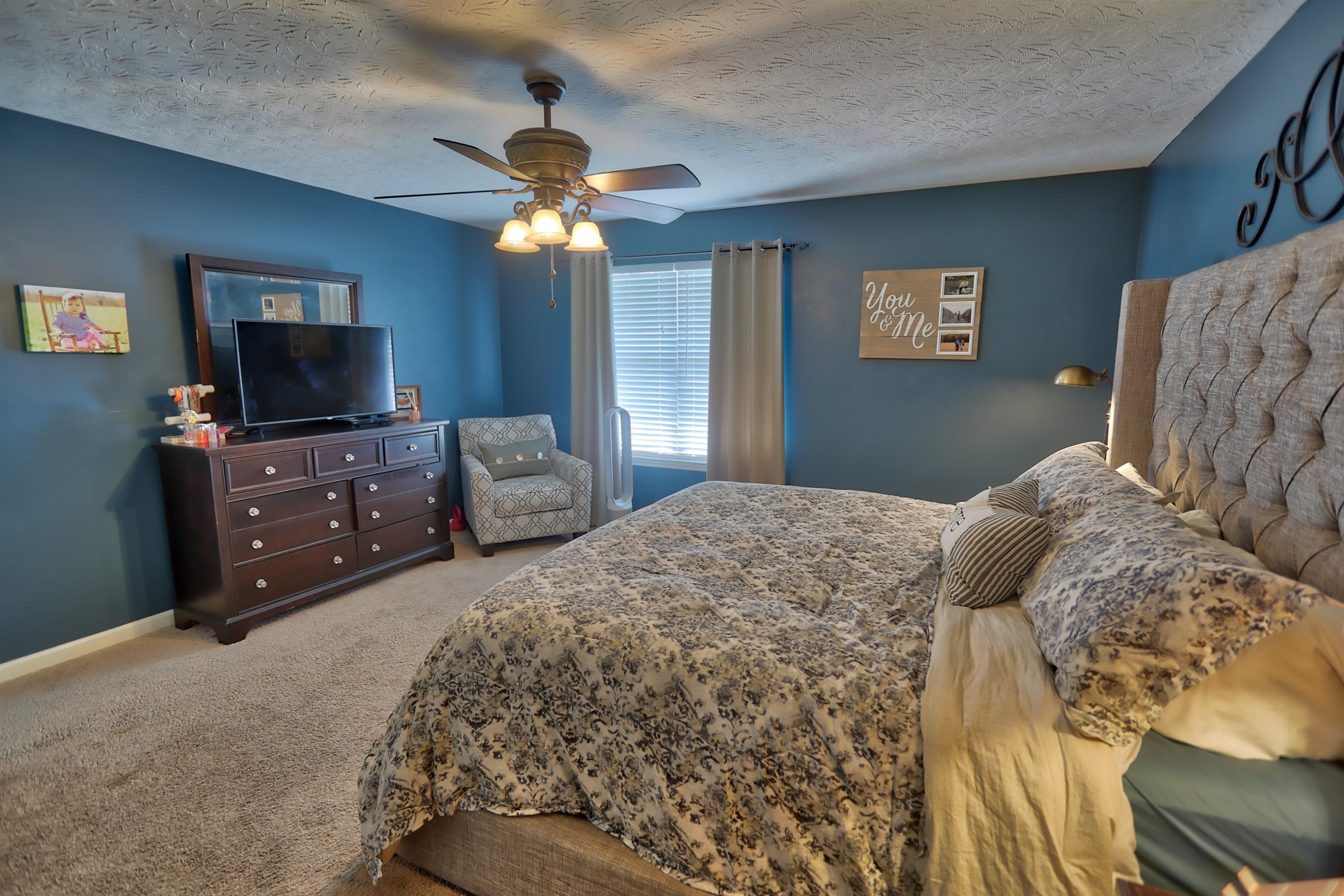3368 Maxie Jones Road Springfield, TN 37172 - Photo 13 of 27 a bedroom with a bed and a television