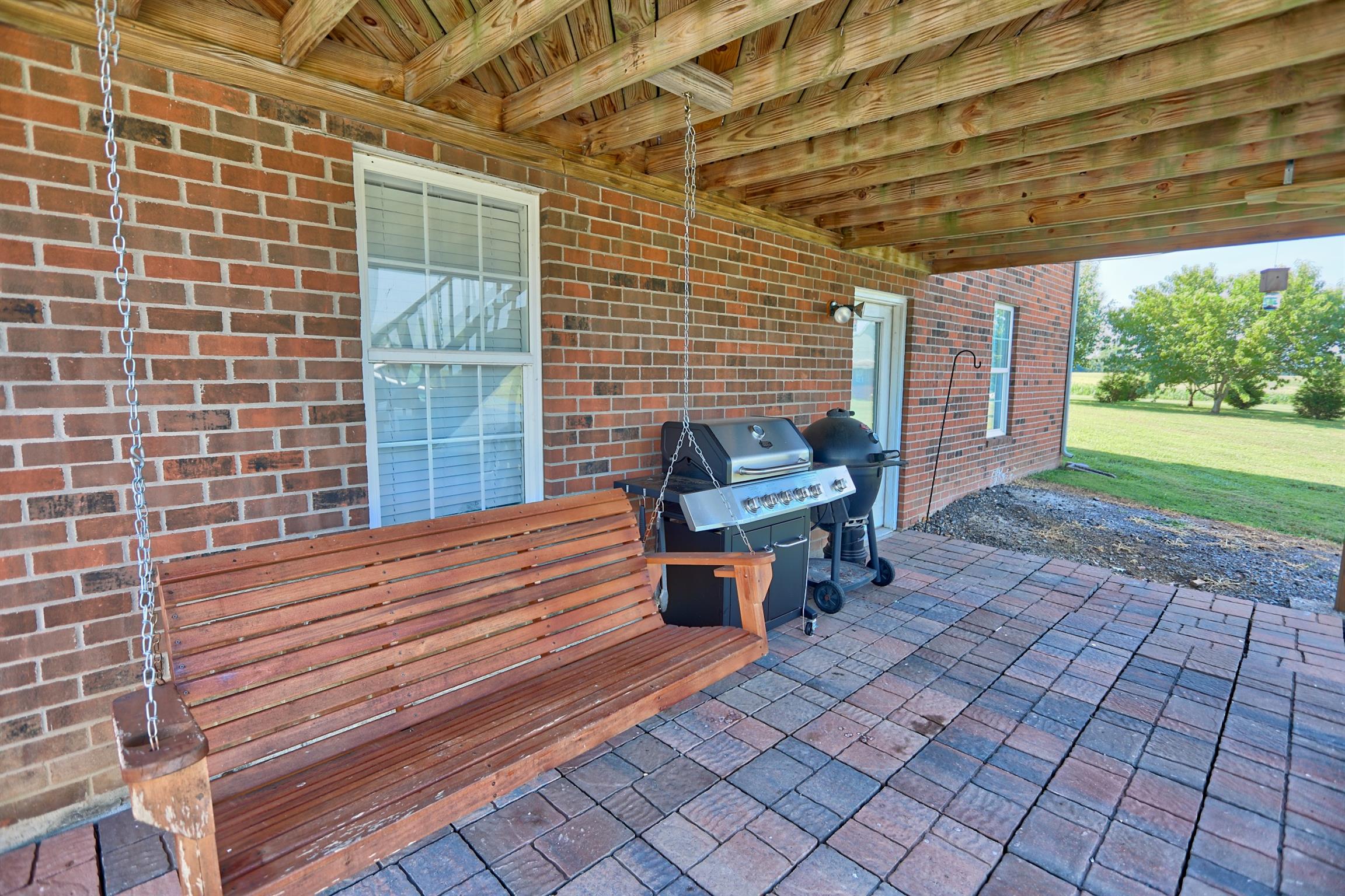 3368 Maxie Jones Road Springfield, TN 37172 - Photo 23 of 27 a view of a patio with table and chairs with wooden floor and fence