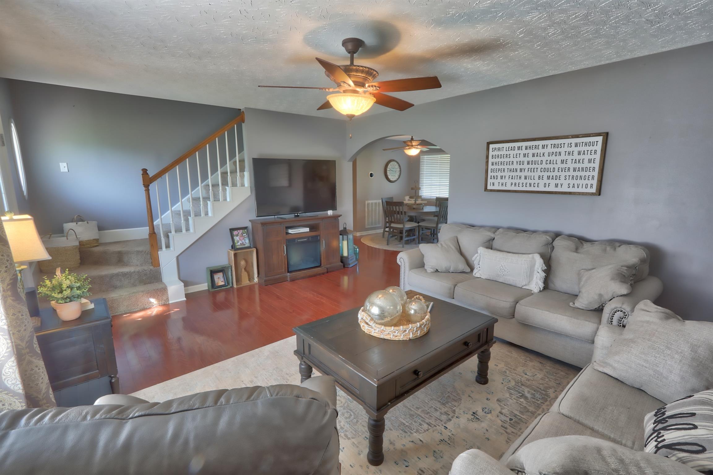 3368 Maxie Jones Road Springfield, TN 37172 - Photo 8 of 27 a living room with furniture and a chandelier