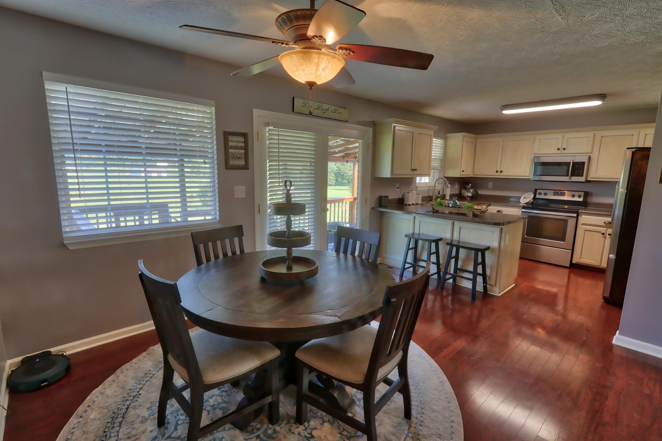 3368 Maxie Jones Road Springfield, TN 37172 - Photo 9 of 27 a view of a dining room with furniture window and wooden floor