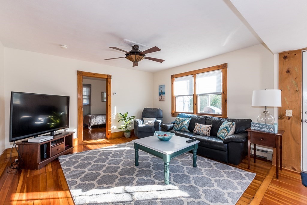 19 Cahoon Road Wareham, MA 02532 - Photo 12 of 34 a living room with furniture and a flat screen tv