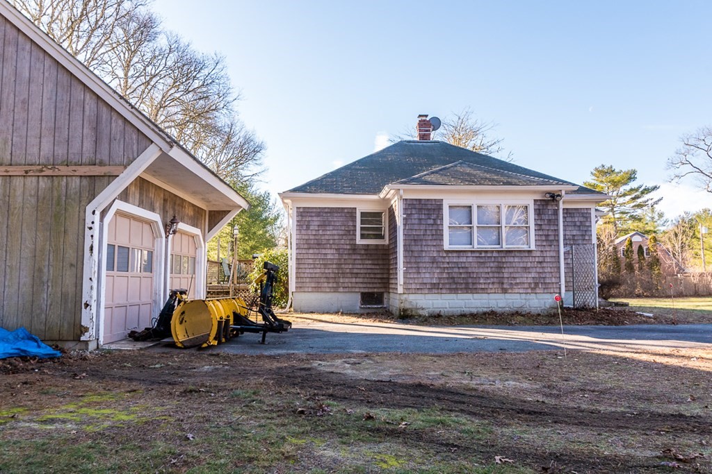 19 Cahoon Road Wareham, MA 02532 - Photo 33 of 34 a view of a house with a yard and wooden fence