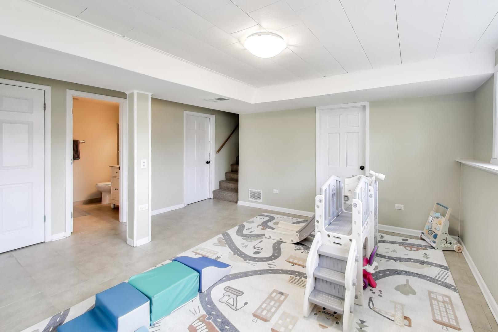 906 Hickory Lane Naperville, IL 60540 - Photo 21 of 30 a bedroom with furniture and a wooden floor