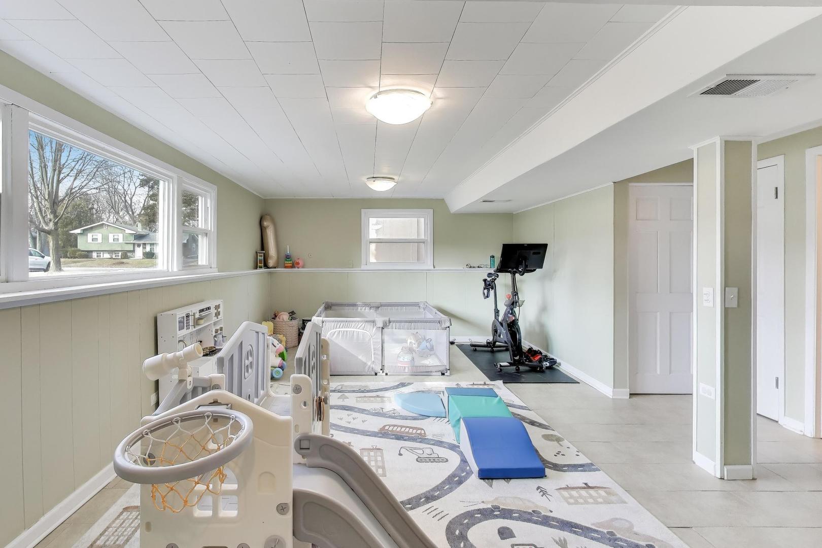 906 Hickory Lane Naperville, IL 60540 - Photo 22 of 30 a room with furniture and a window