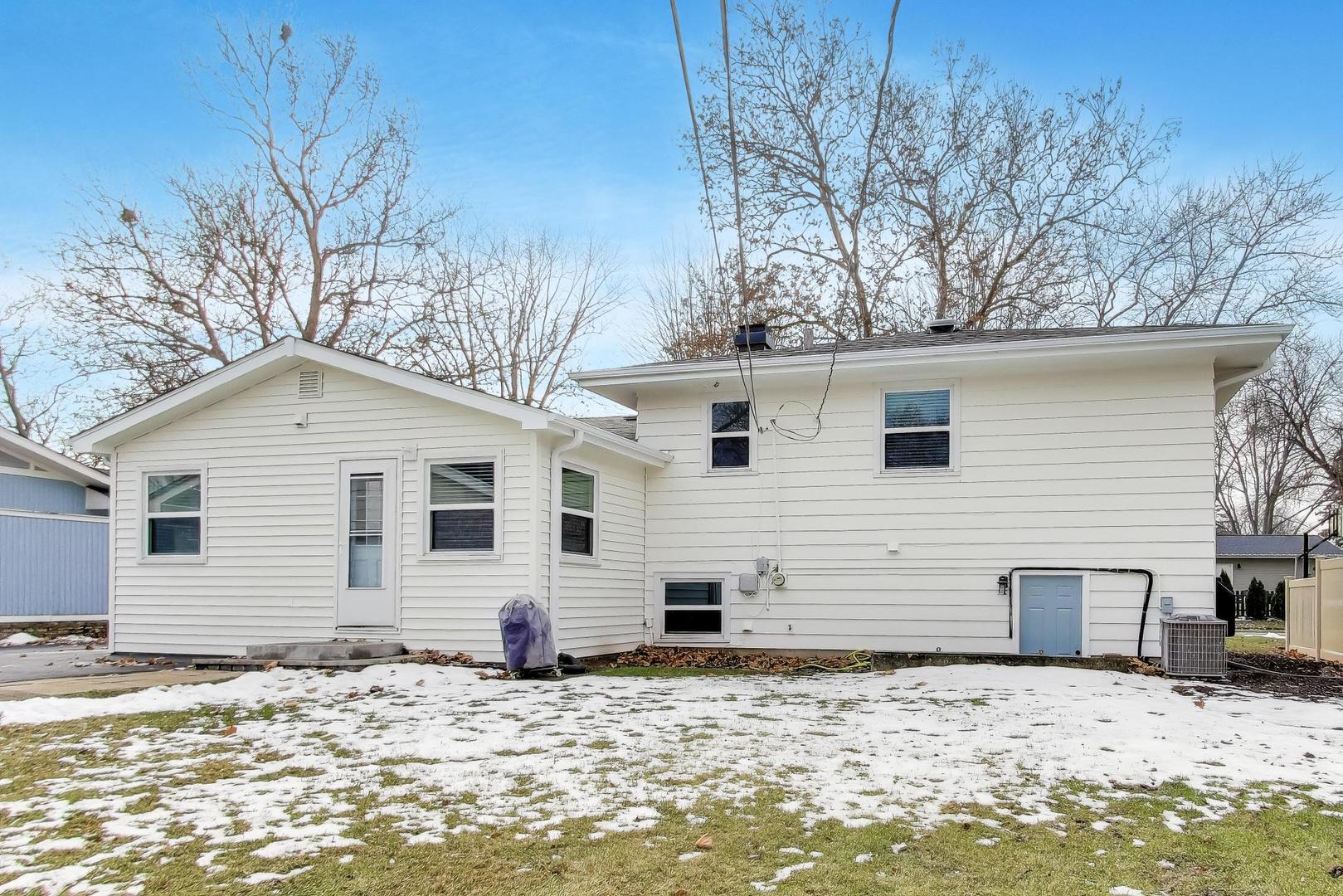 906 Hickory Lane Naperville, IL 60540 - Photo 25 of 30 a backyard of a house with large trees