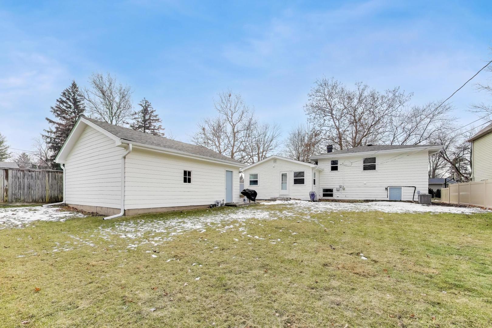 906 Hickory Lane Naperville, IL 60540 - Photo 26 of 30 a view of a house with a yard