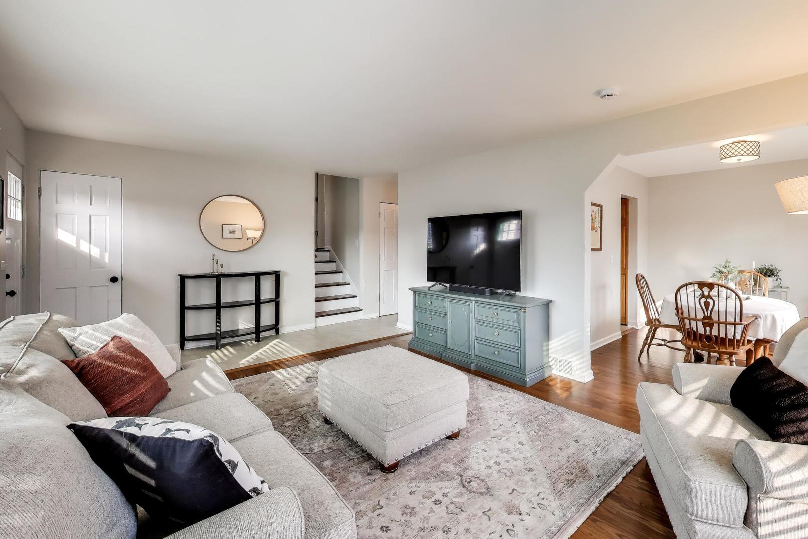 906 Hickory Lane Naperville, IL 60540 - Photo 4 of 30 a living room with furniture and a flat screen tv