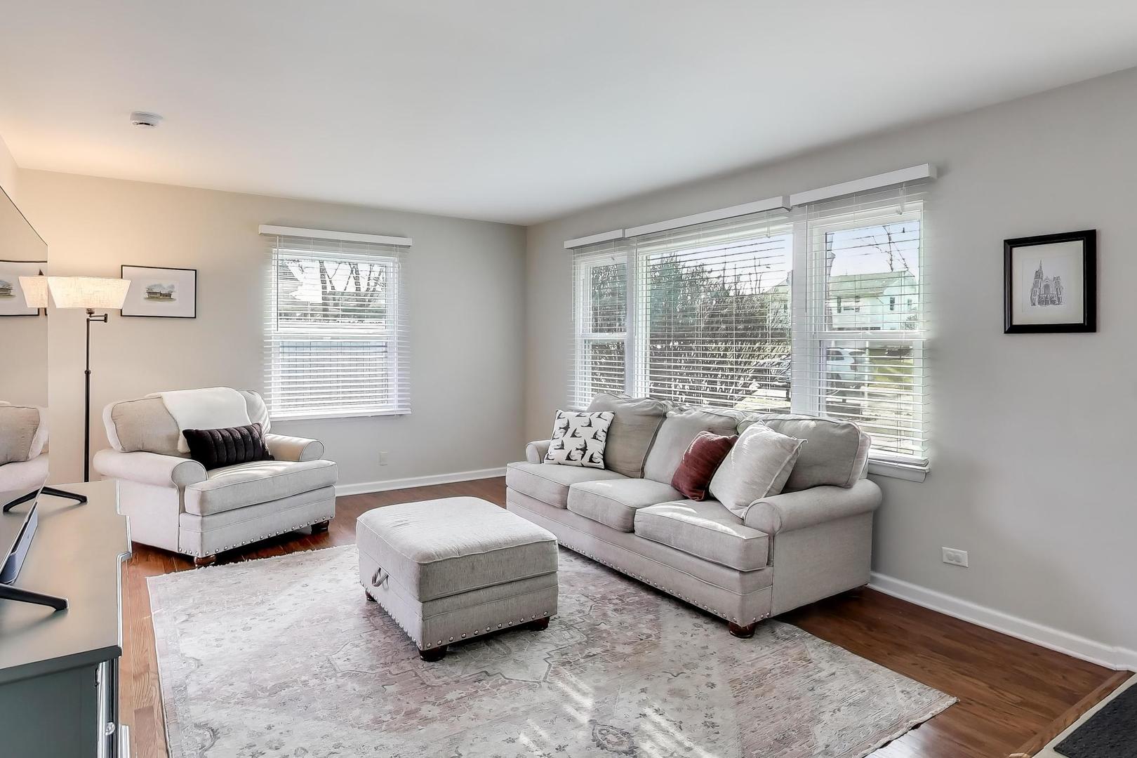 906 Hickory Lane Naperville, IL 60540 - Photo 5 of 30 a living room with furniture and a large window