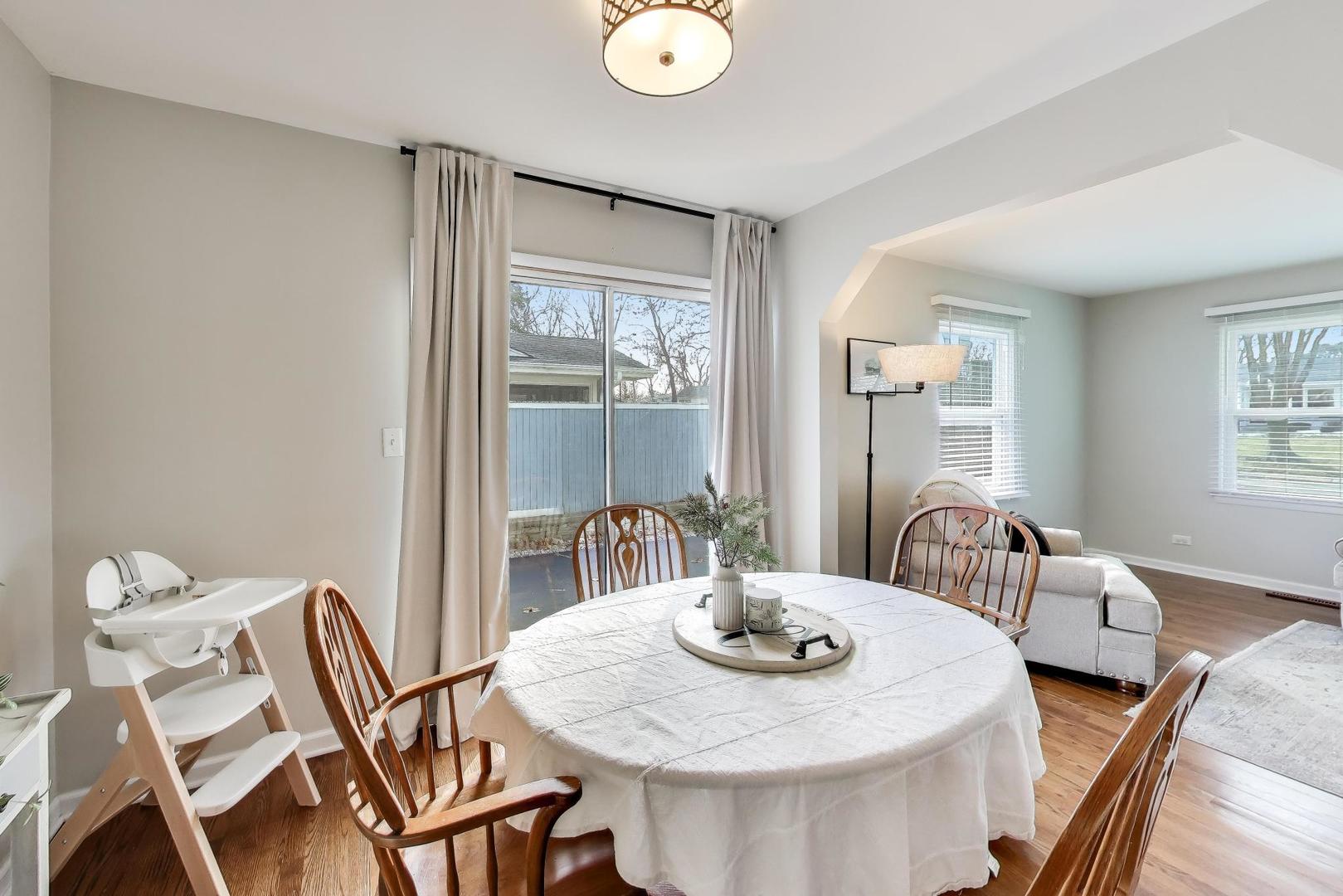 906 Hickory Lane Naperville, IL 60540 - Photo 7 of 30 a view of a dining room with furniture and window