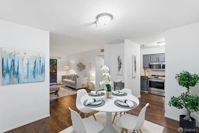a kitchen with stainless steel appliances kitchen island granite countertop a sink and cabinets