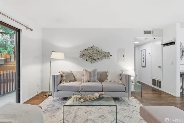 a bedroom with bed and a night stand