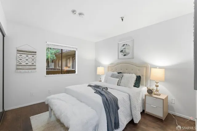 a spacious bedroom with a bed and window