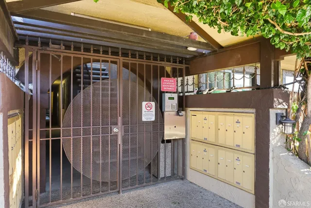 a view of a pathway of a house and a bench