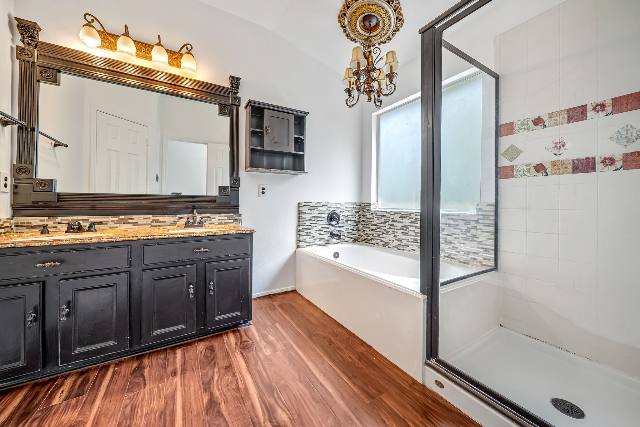 23526 Whispering Maple Drive Spring, TX 77373 - Photo 15 of 26 a spacious bathroom with a tub sink and mirror