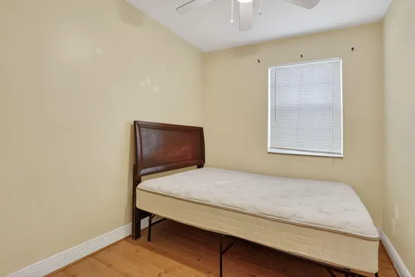 an empty room with windows and closet