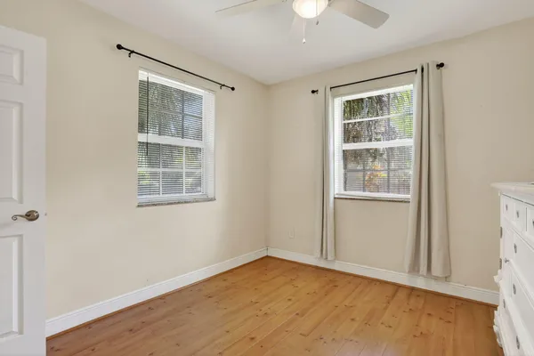 a living room with flat screen tv on the wall and a flat screen tv