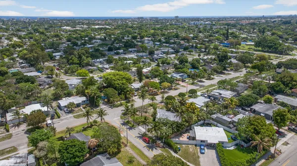 an aerial view of residential houses with outdoor space