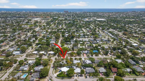 an aerial view of residential houses with city view