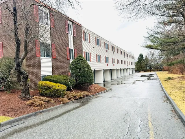 a view of street with parked cars