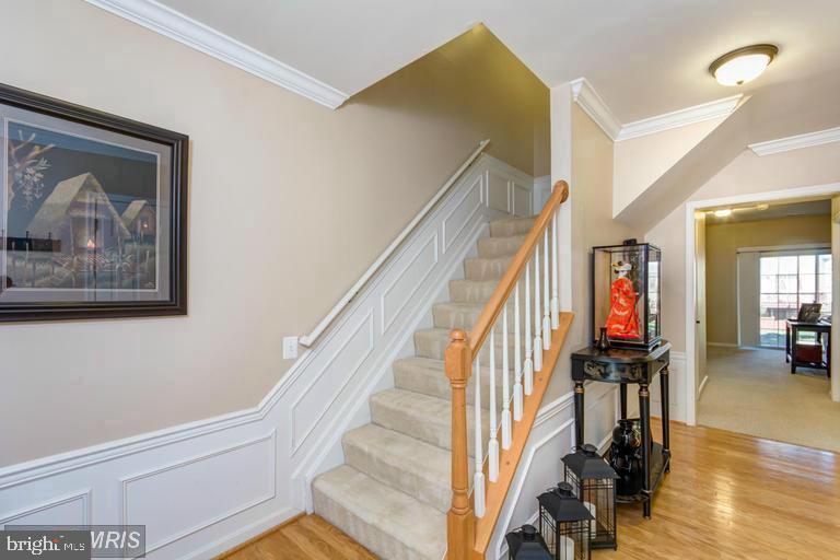 20927 Trinity Square Sterling, VA 20165 - Photo 2 of 23 Inviting entryway with elegant staircase.