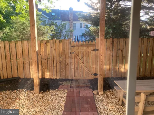 a view of balcony with wooden floor and fence