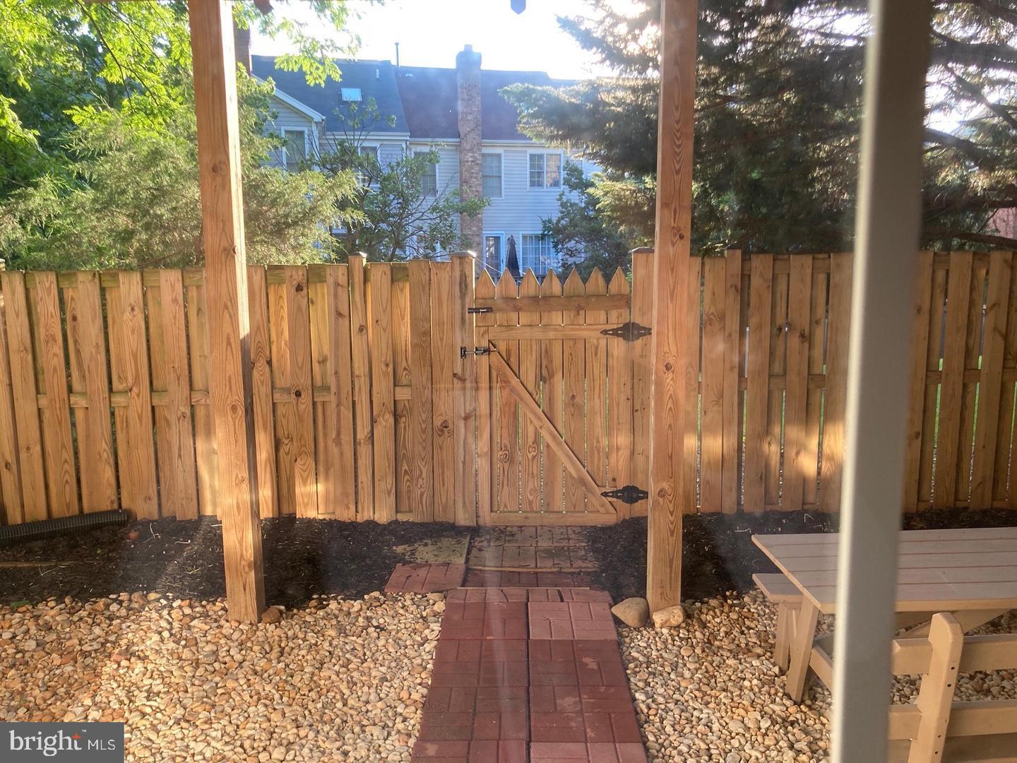 20927 Trinity Square Sterling, VA 20165 - Photo 22 of 23 Charming fenced yard with inviting gate.