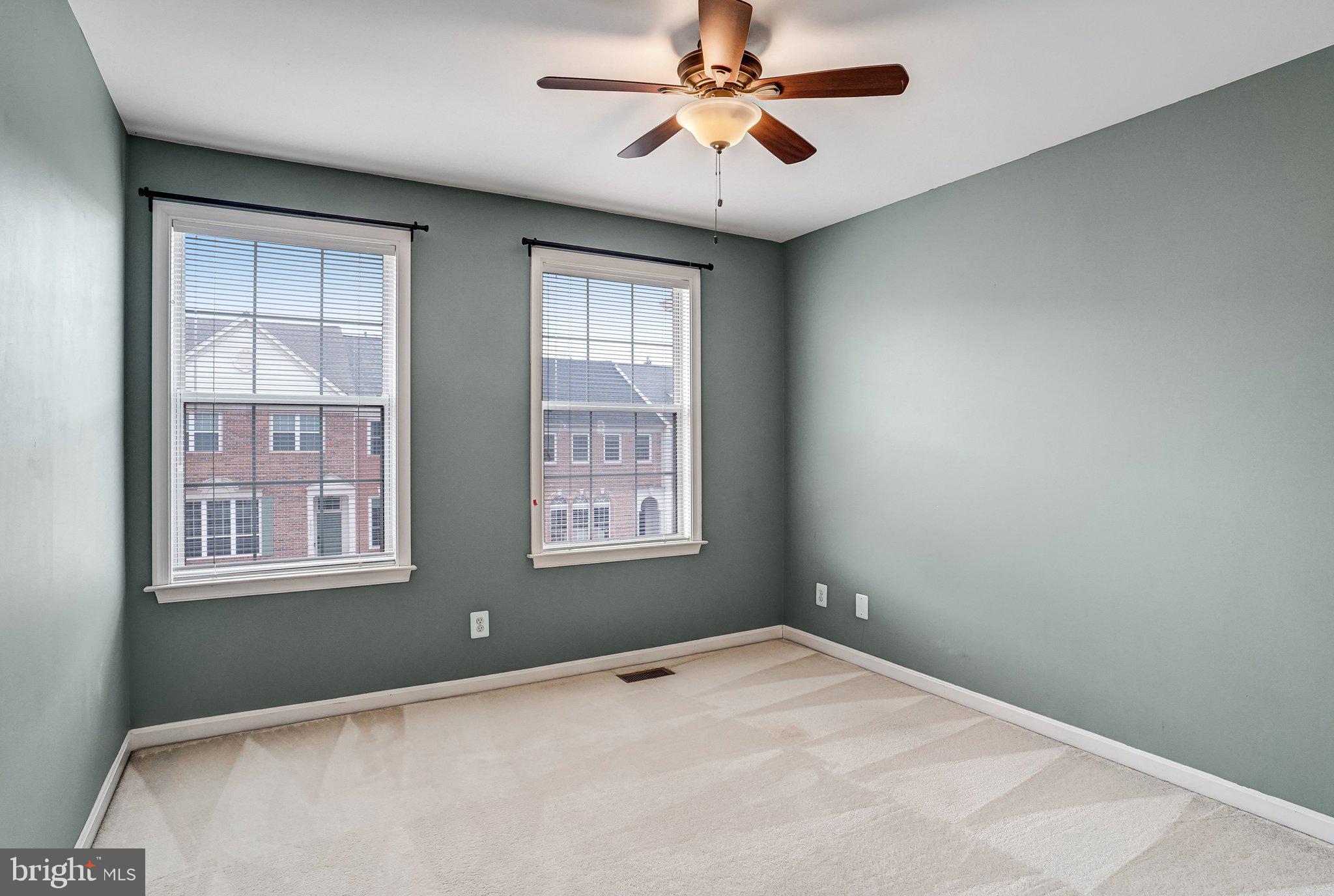 20927 Trinity Square Sterling, VA 20165 - Photo 30 of 47 an empty room with windows and fan