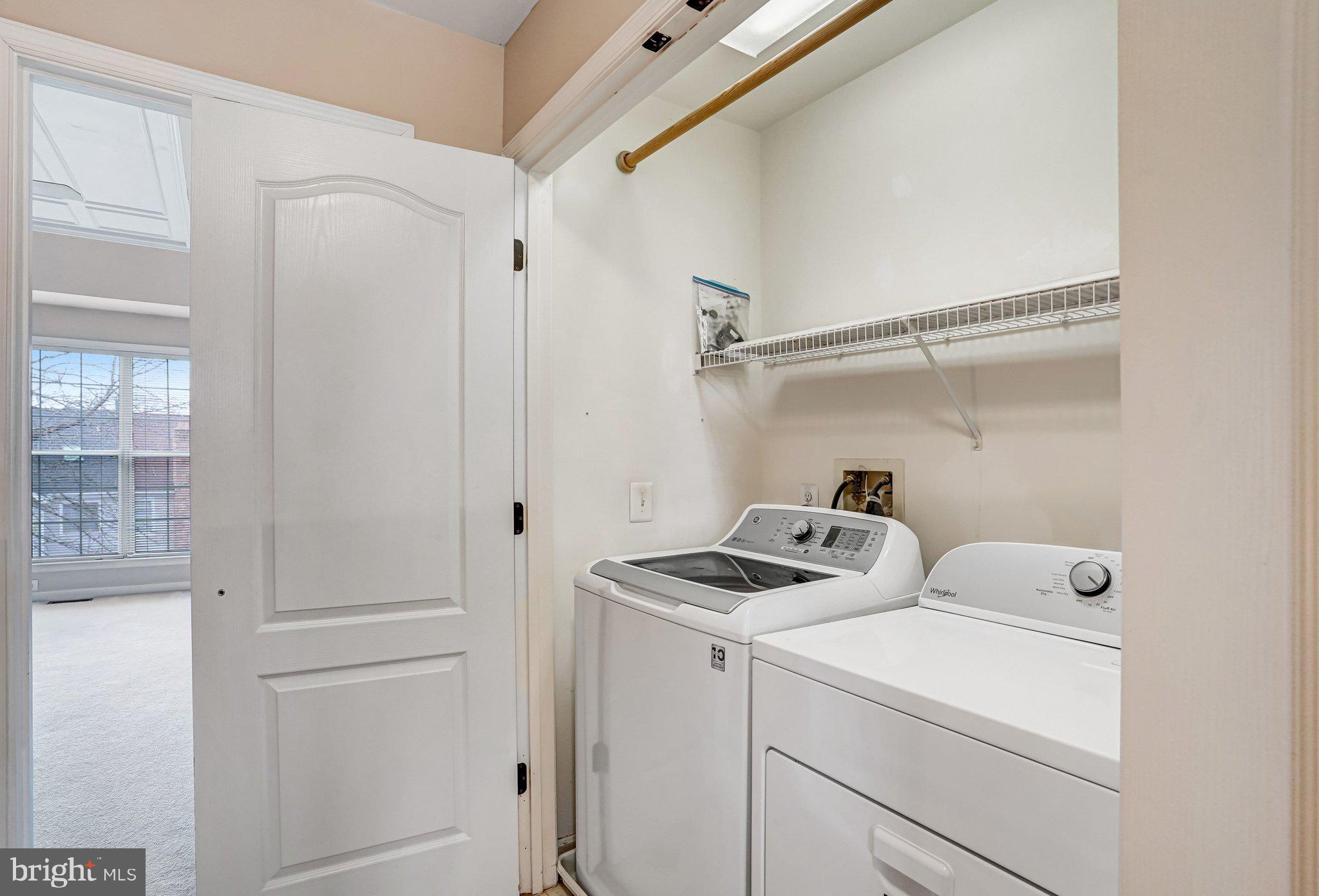 20927 Trinity Square Sterling, VA 20165 - Photo 33 of 47 a view of storage and utility room with washer and dryer