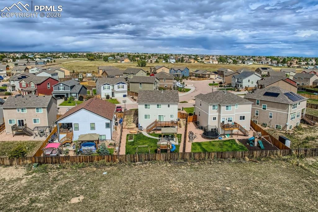 11329 Avena Road Peyton, CO 80831 - Photo 42 of 42 an aerial view of a house with a yard