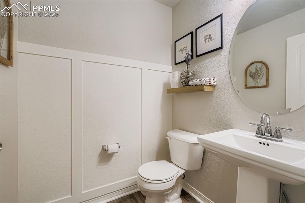 11329 Avena Road Peyton, CO 80831 - Photo 10 of 42 a bathroom with a sink a toilet and mirror