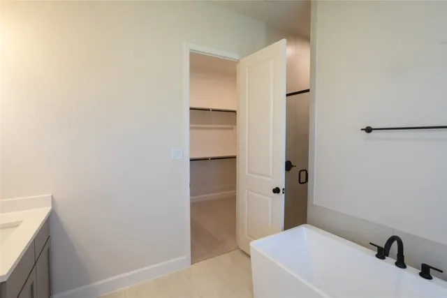 a bathroom with a sink and shower