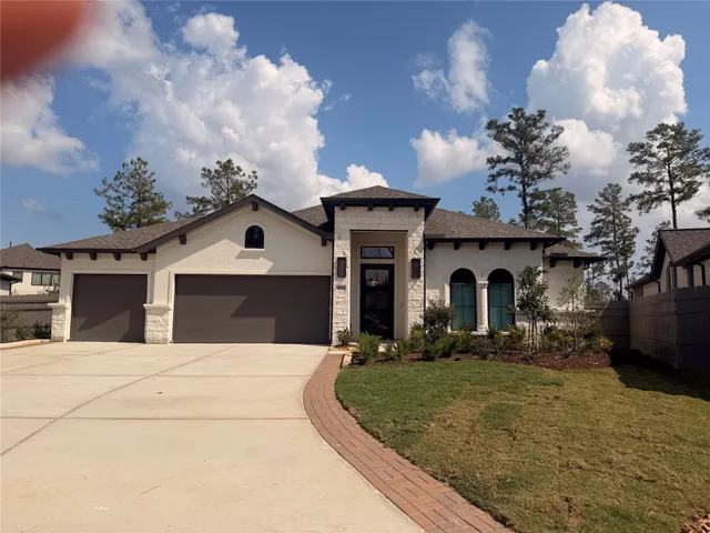 a front view of a house with yard