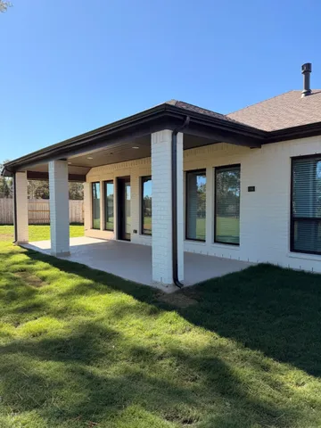 a view of a park with a tree in a yard