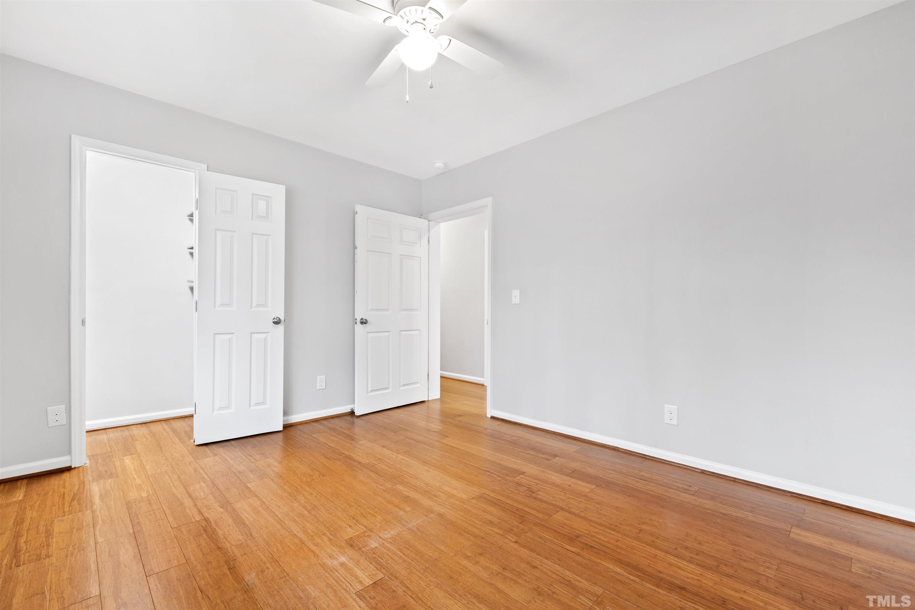 2528 Optimist Farm Road Apex, NC 27539 - Photo 34 of 49 a view of an empty room with wooden floor