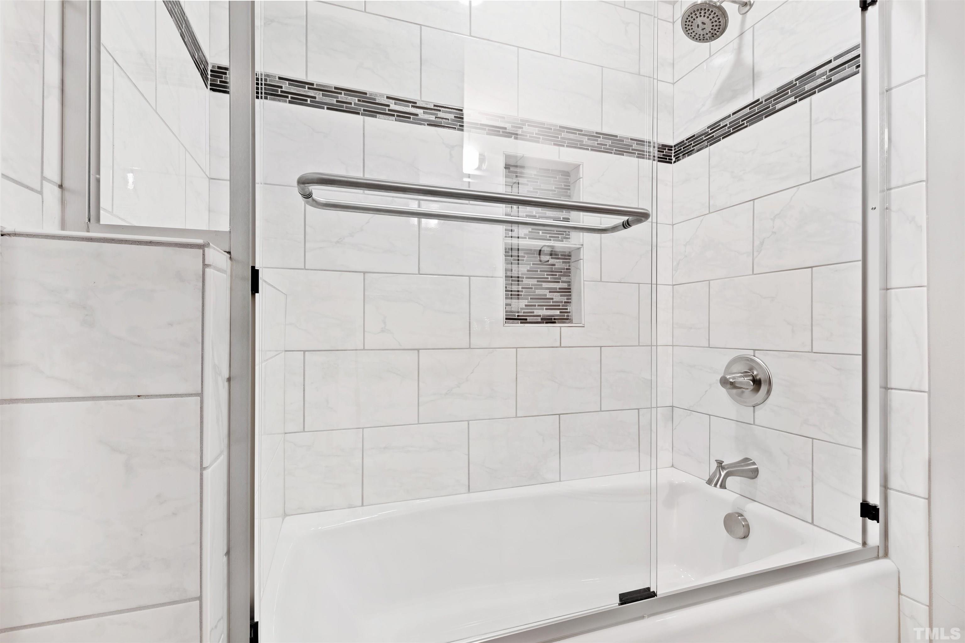 2528 Optimist Farm Road Apex, NC 27539 - Photo 42 of 49 a bathroom with a bathtub