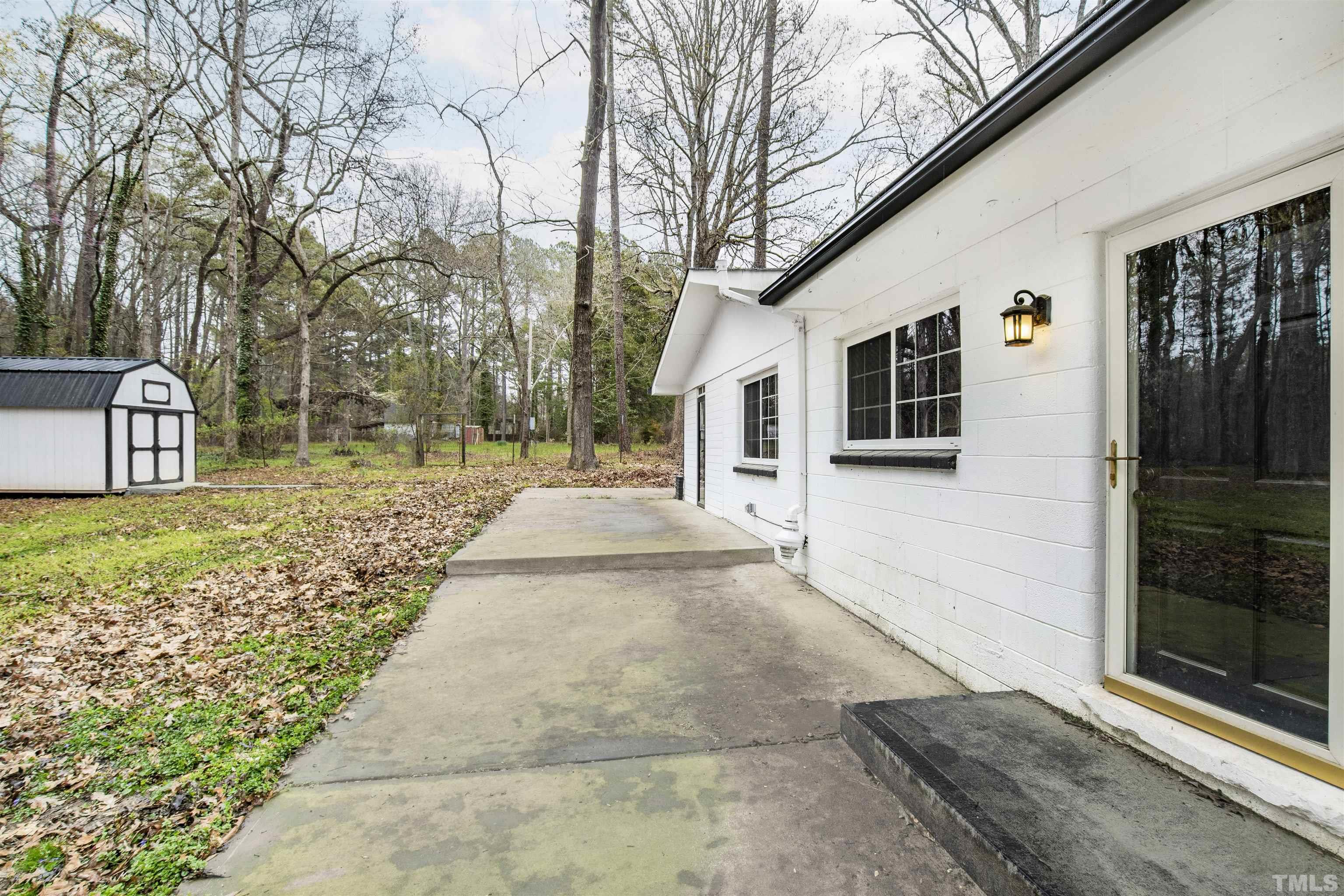 2528 Optimist Farm Road Apex, NC 27539 - Photo 45 of 49 a front view of a house with garden