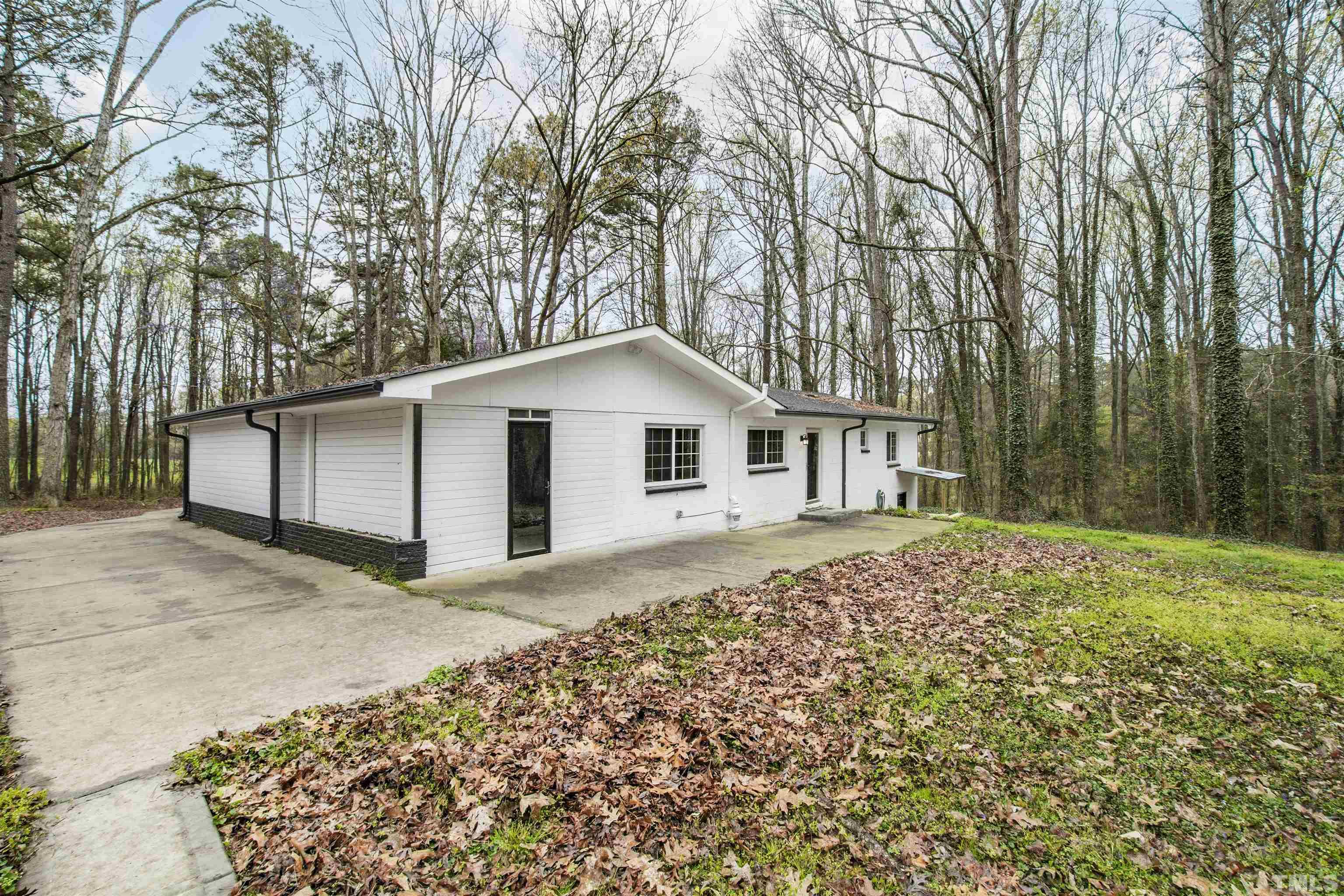 2528 Optimist Farm Road Apex, NC 27539 - Photo 46 of 49 a view of a house with a yard