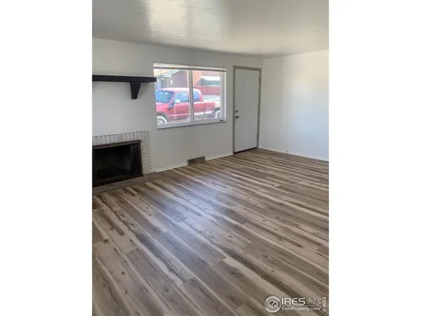 a view of a room with a flat screen tv