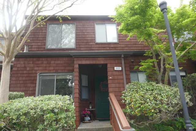 front view of a house with a garden