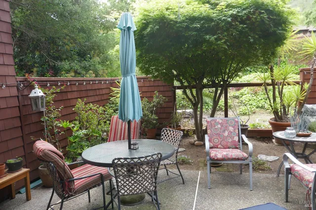 a patio with table and chairs