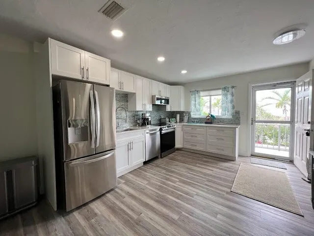 a bedroom with a bed and a television