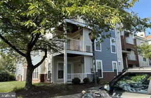 front view of a house with a tree