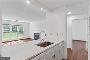 20979 Timber Ridge Terrace, Unit 101 Ashburn, VA 20147 - Photo 5 of 16 a kitchen with a sink and a large window