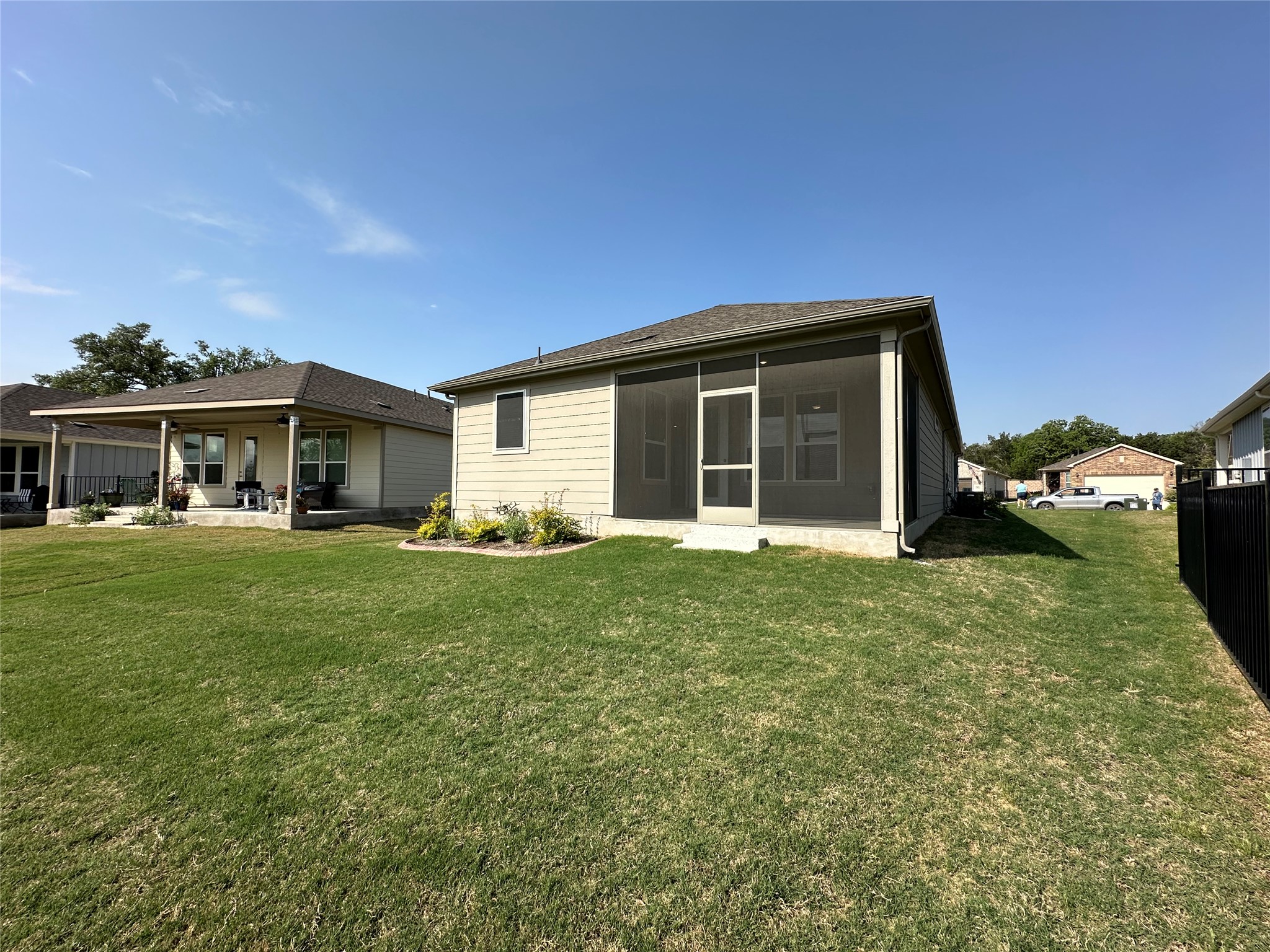 219 Coachsmith Street Georgetown, TX 78633 - Photo 24 of 25 Rear view of property featuring a sunroom, a patio, fence, and a lawn