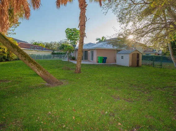 a view of a backyard of the house