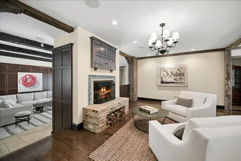 a living room with furniture and a floor to ceiling window