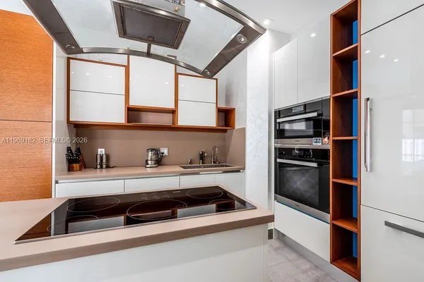 a kitchen with stainless steel appliances a stove and a refrigerator