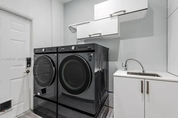a utility room with dryer and washer