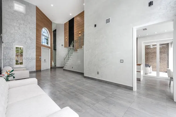 a view of a livingroom with furniture and windows