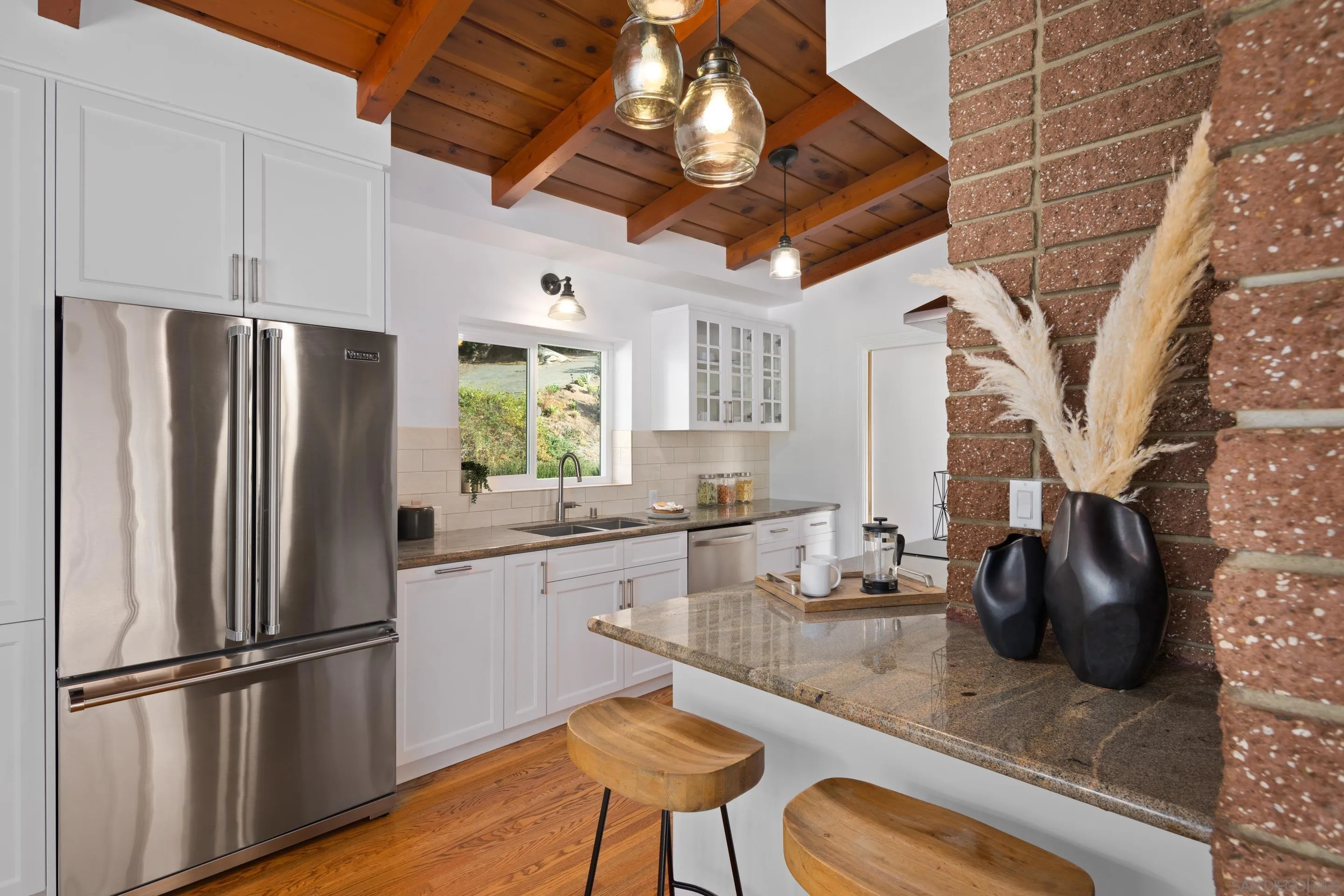 9560 Starlight Lane La Mesa, CA 91941 - Photo 7 of 18 a kitchen with stainless steel appliances granite countertop a refrigerator and a stove top oven